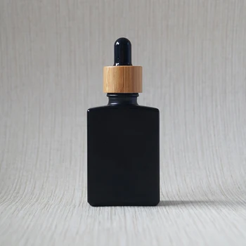 Custom didmeninė 30ml 50ml 100ml maisto kokybės juodos matinės kvadrato, stačiakampio eterinio aliejaus stiklo buteliukas su lašintuvu bambuko bžūp